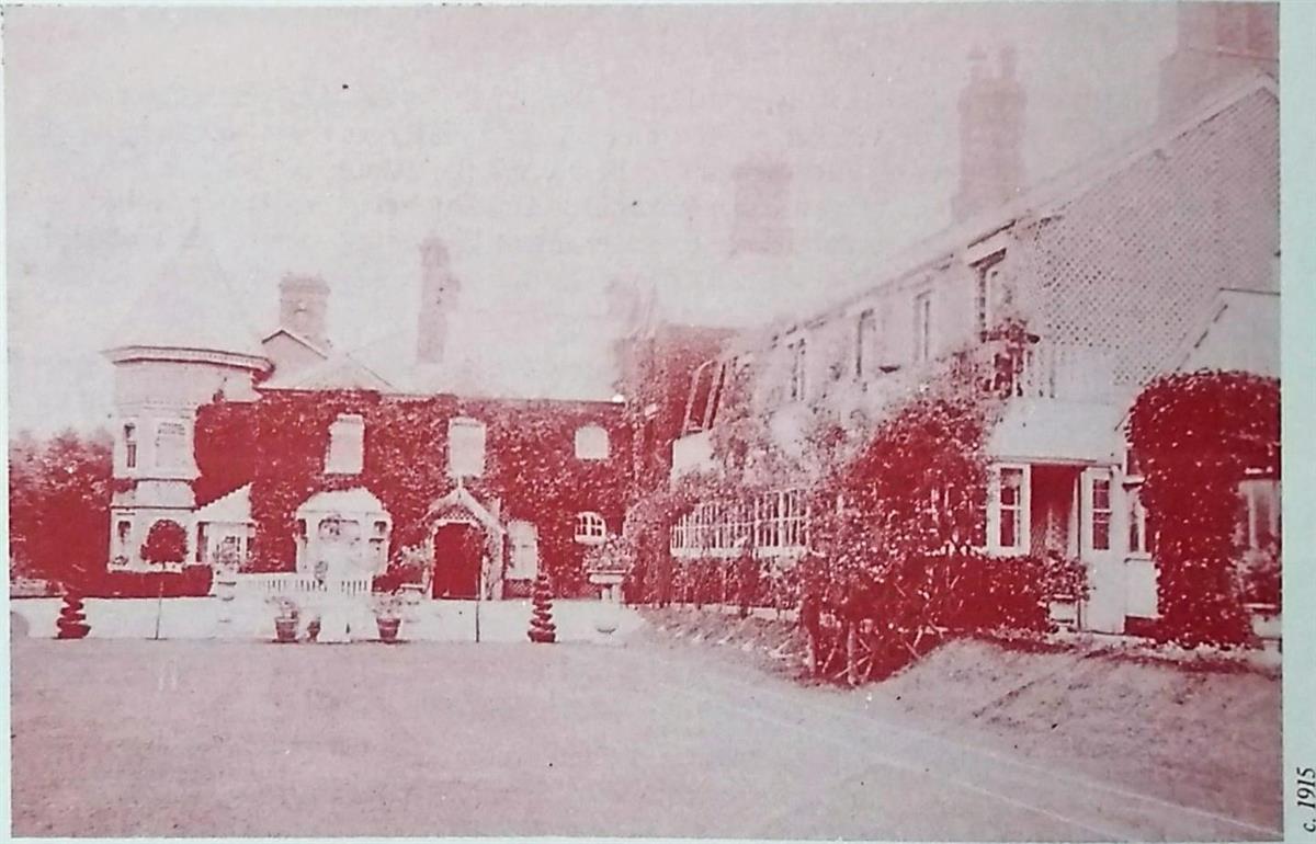 red and white picture of a manor house